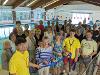 Ringmer residents and pool supporters Joyce Wiles (left) and Angela Glaysher (right) cut the ribbon with Wave Active lifeguards at the official re-opening of Ringmer Swimming Pool on Saturday
