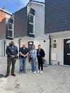 Image of Cllr Diplock (second from left) with council officers outside the new homes in Susans Road.